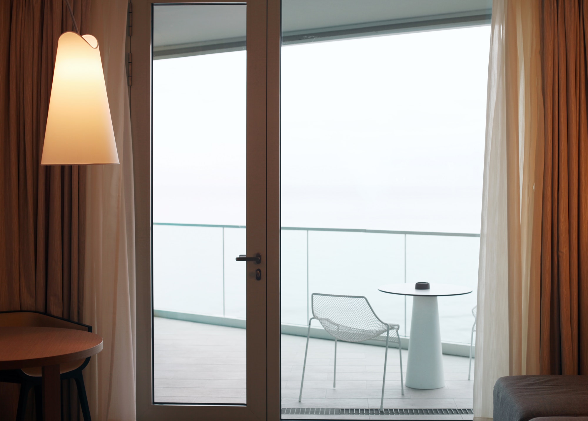 Living room with glass door to balcony. Sea view.